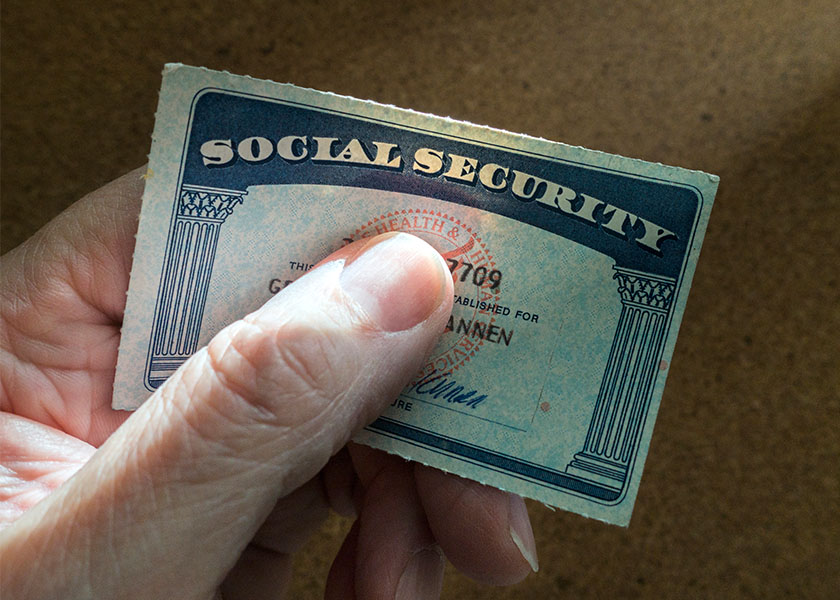 Hand holding a Social Security card